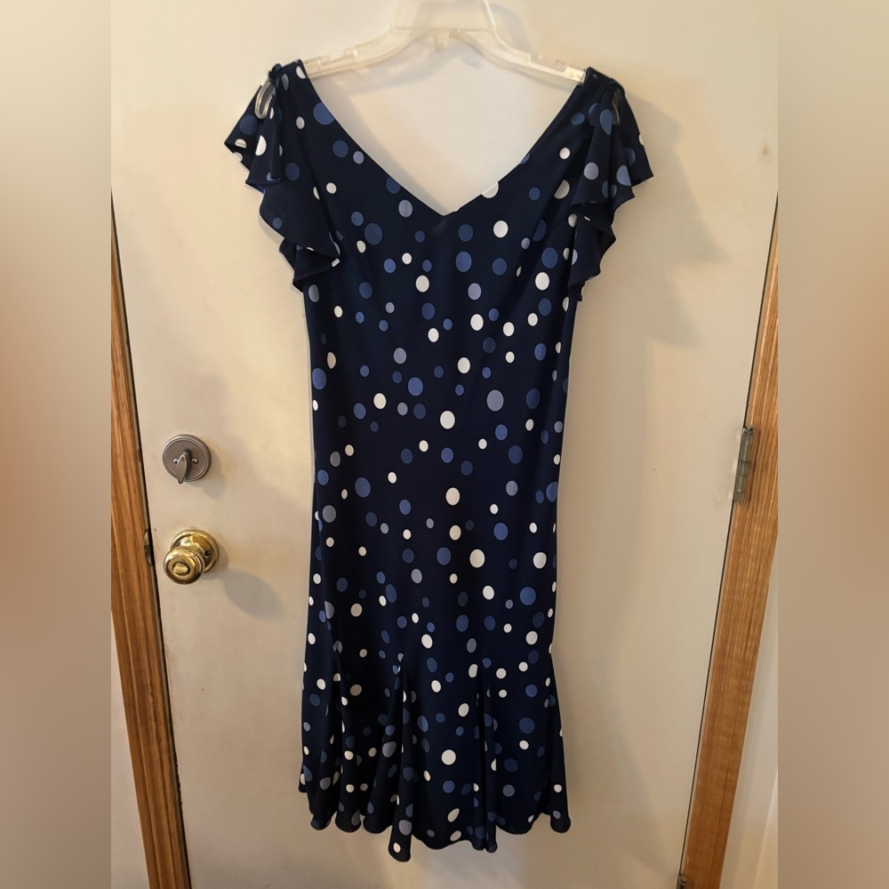 Size 10 navy dress with polka dots. Ruffled cap sleeves.